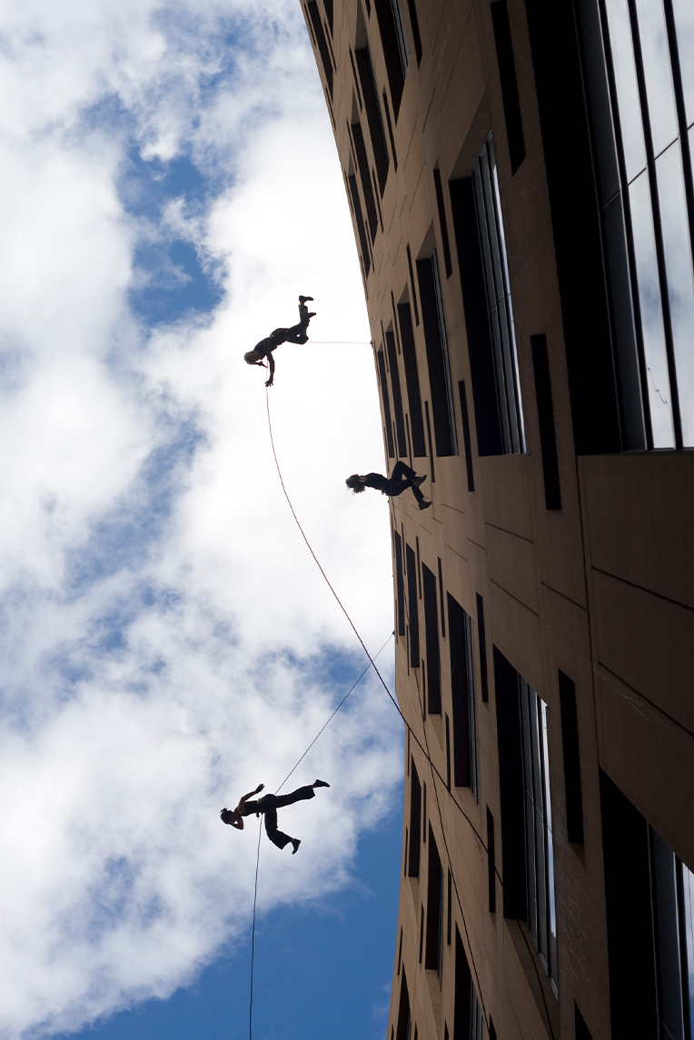 Julia Taffe's Aeriosa dancers suspended from the roof of the Main Branch of the Vancouver Public Library.