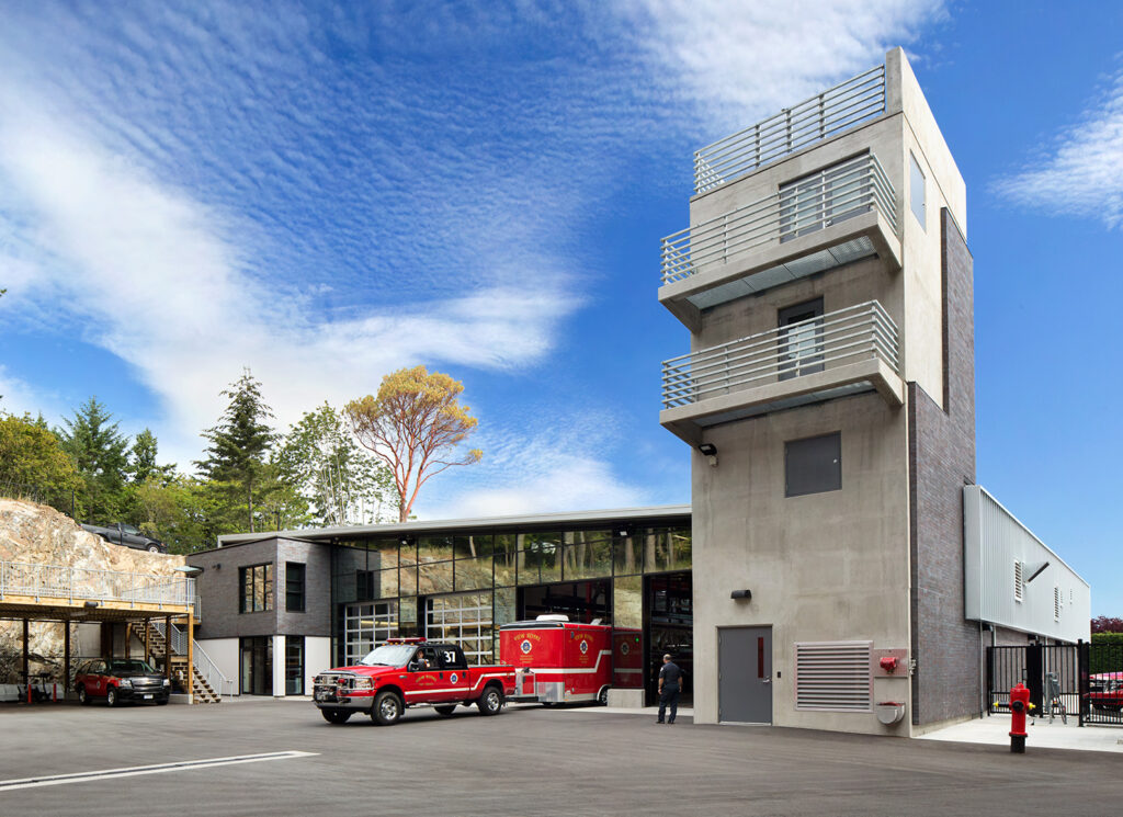 Back of firehall with a tower.