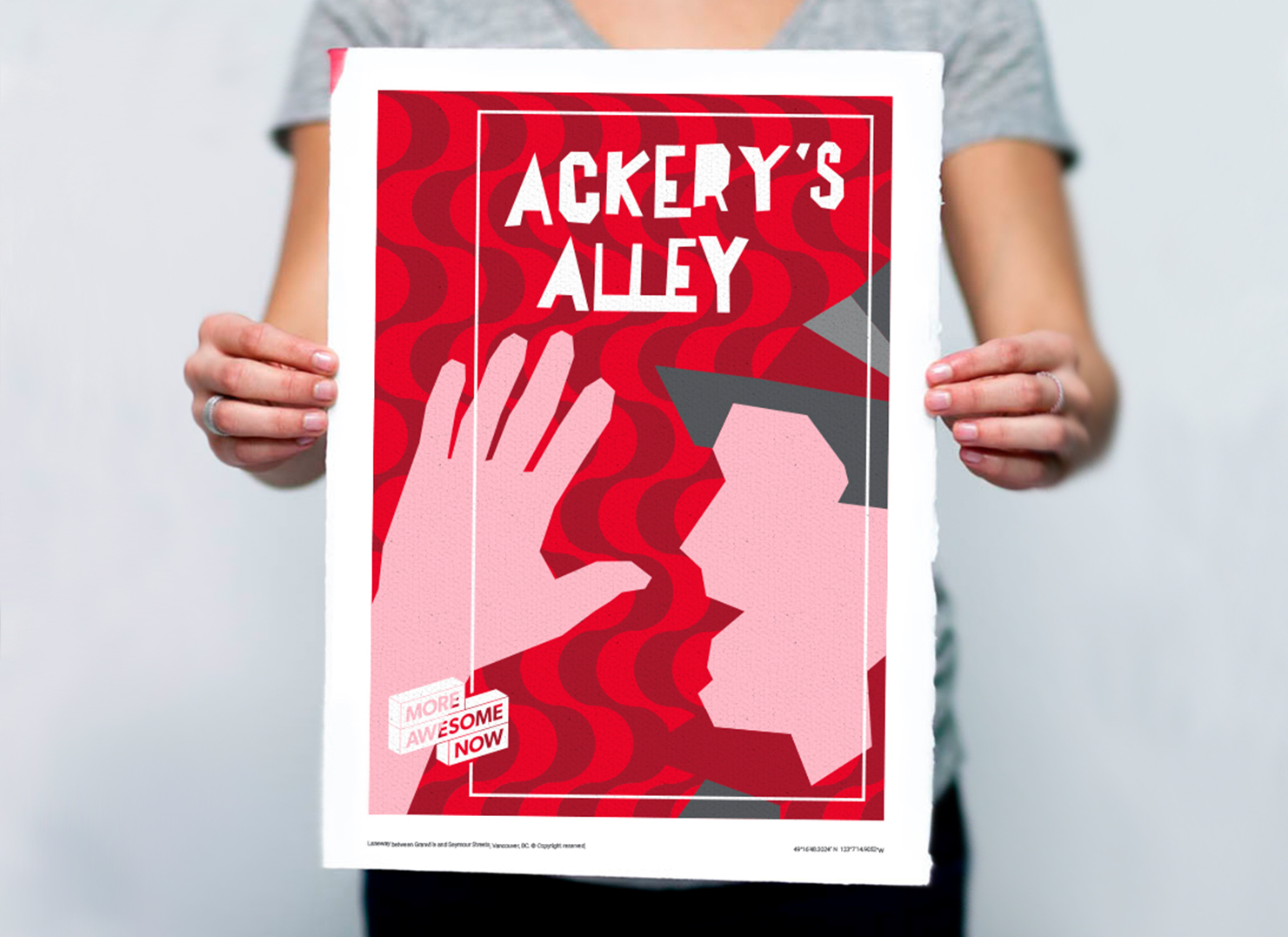 Someone holding a cut-out illustration for Ackery's Alley.