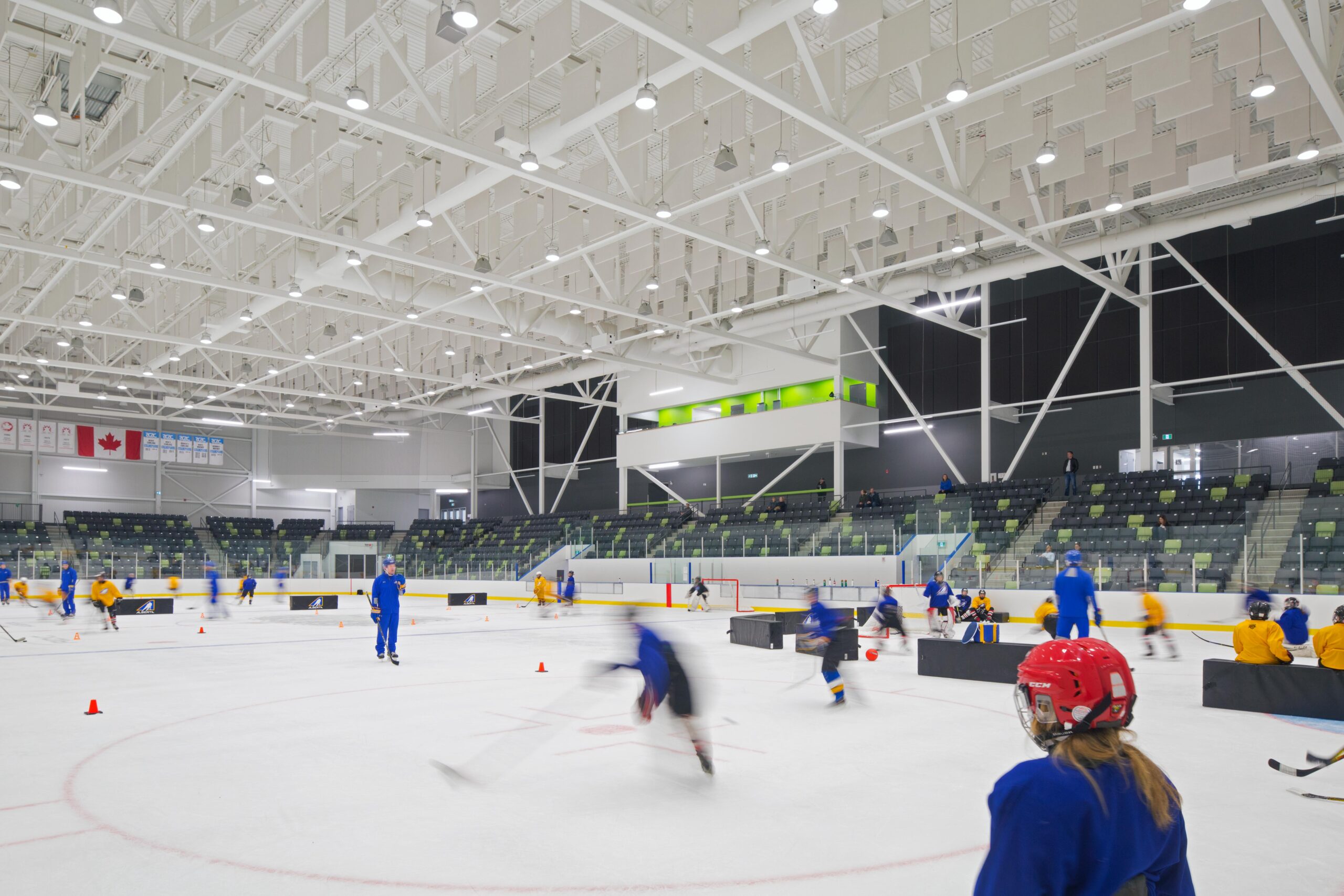 Hockey teams are seen skating on the ice-rink at Gary W. Harris Canada Centre.