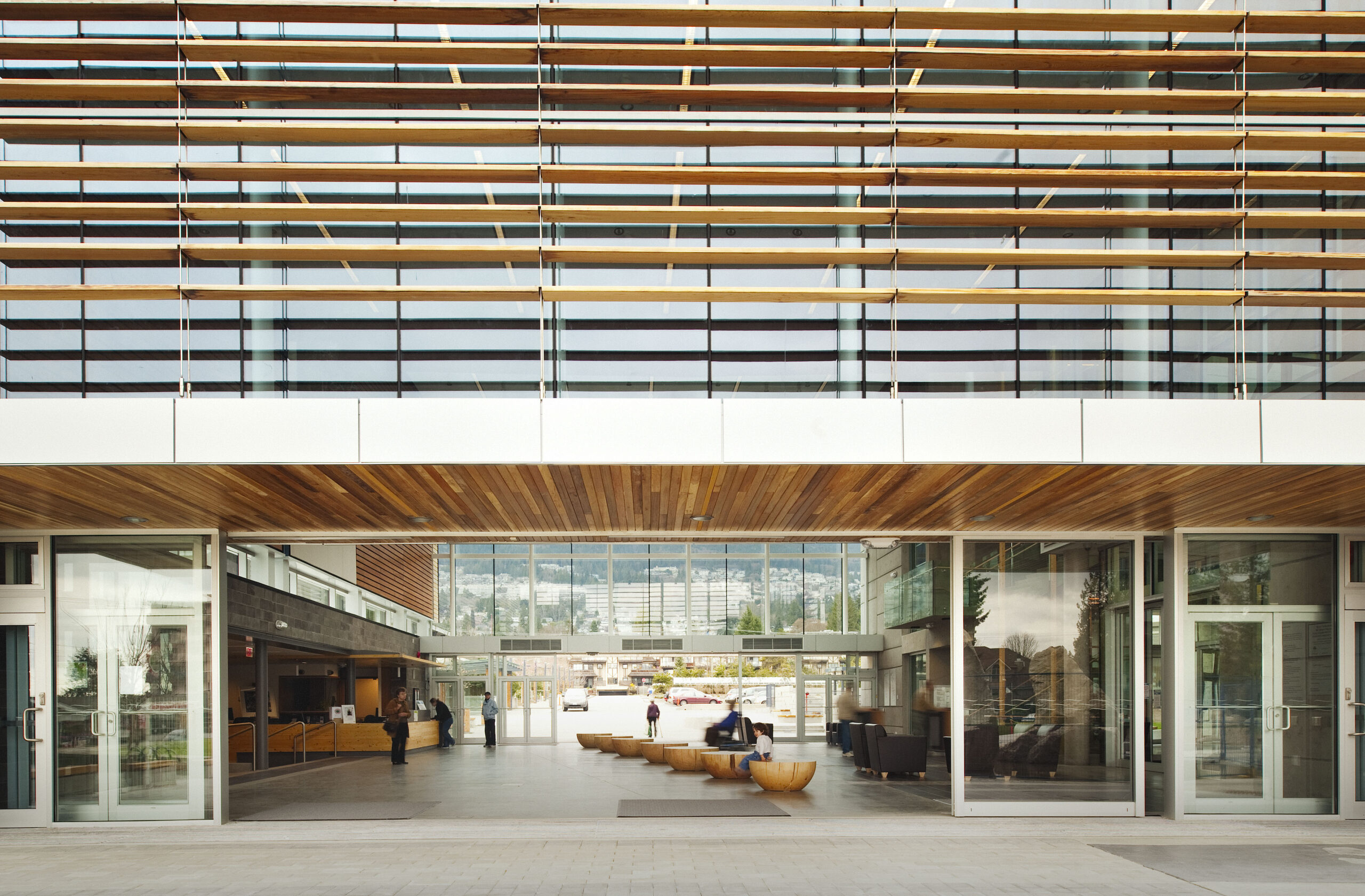 View through open doors into the West Vancouver Aquatic & Community Centre atrium.