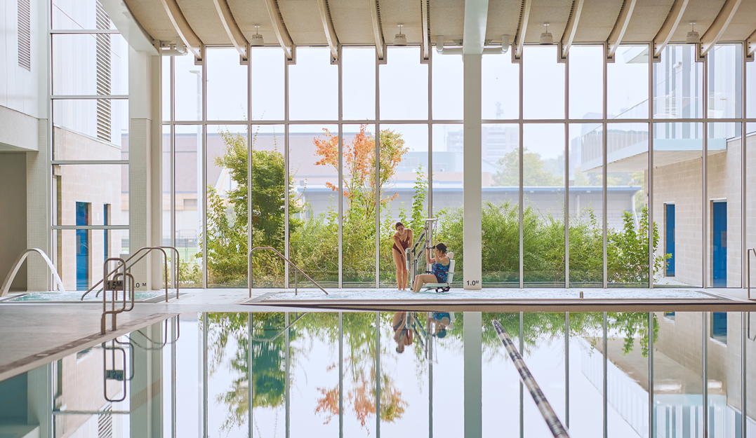 The lift at the Minoru Centre for Active Living (MCAL) in Richmond BC helps individuals with mobility aids enter the hot pool. Photo credit: Hubert Kang