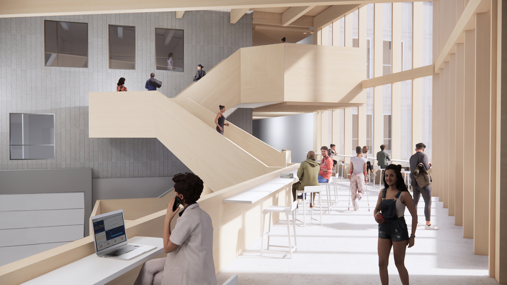 View of indoor balcony with students walking up the staircase.