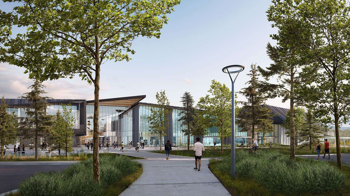 Rendering of outside entrance to təməsew̓txʷ Aquatic and Community Centre surrounded by nature.
