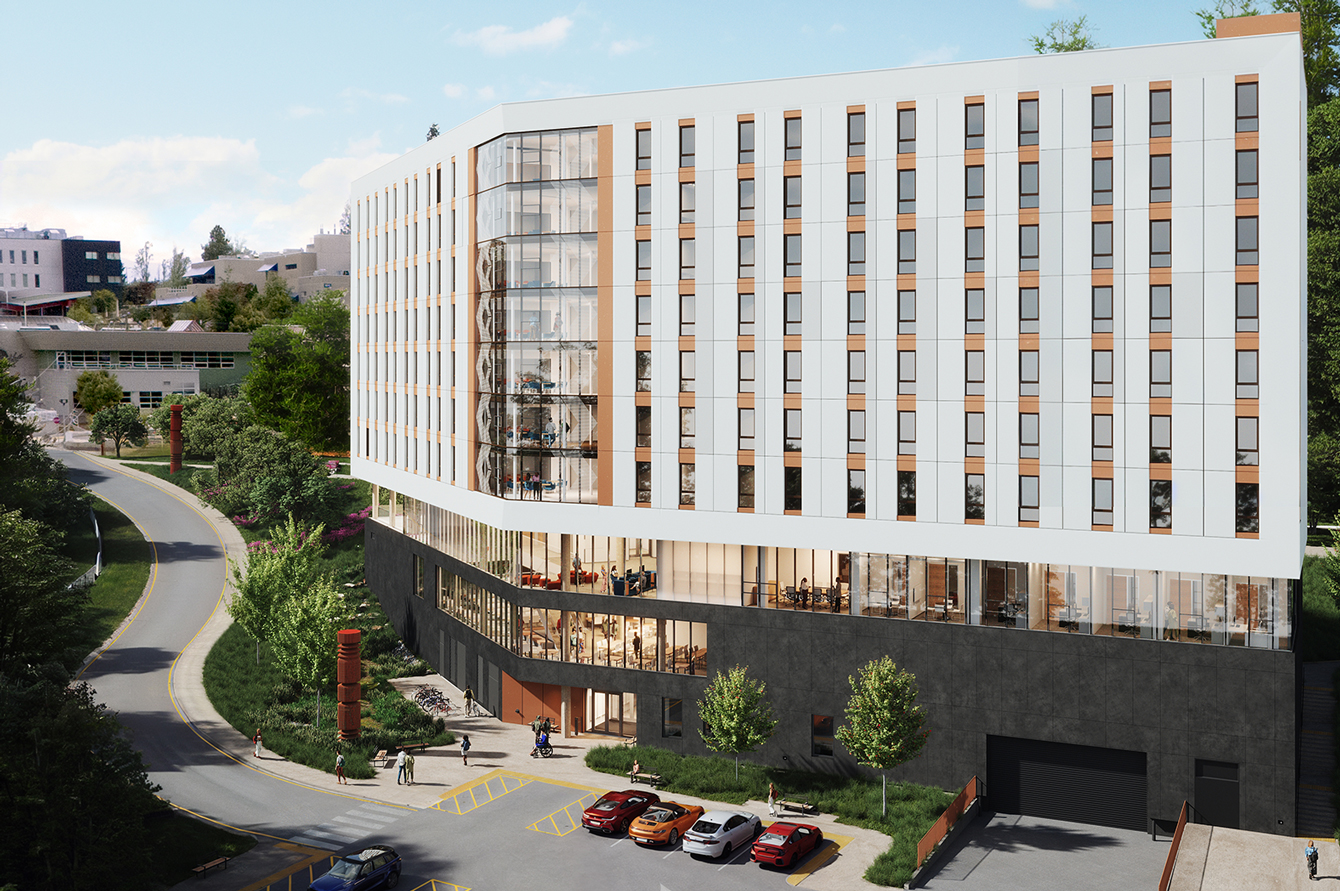 Exterior rendering of the south entry, with the tower and broader campus in view. Glazing shows views into warm interiors on the second and third floors, and outside there is parking, a rain garden with a welcome pole, and a loading area. 